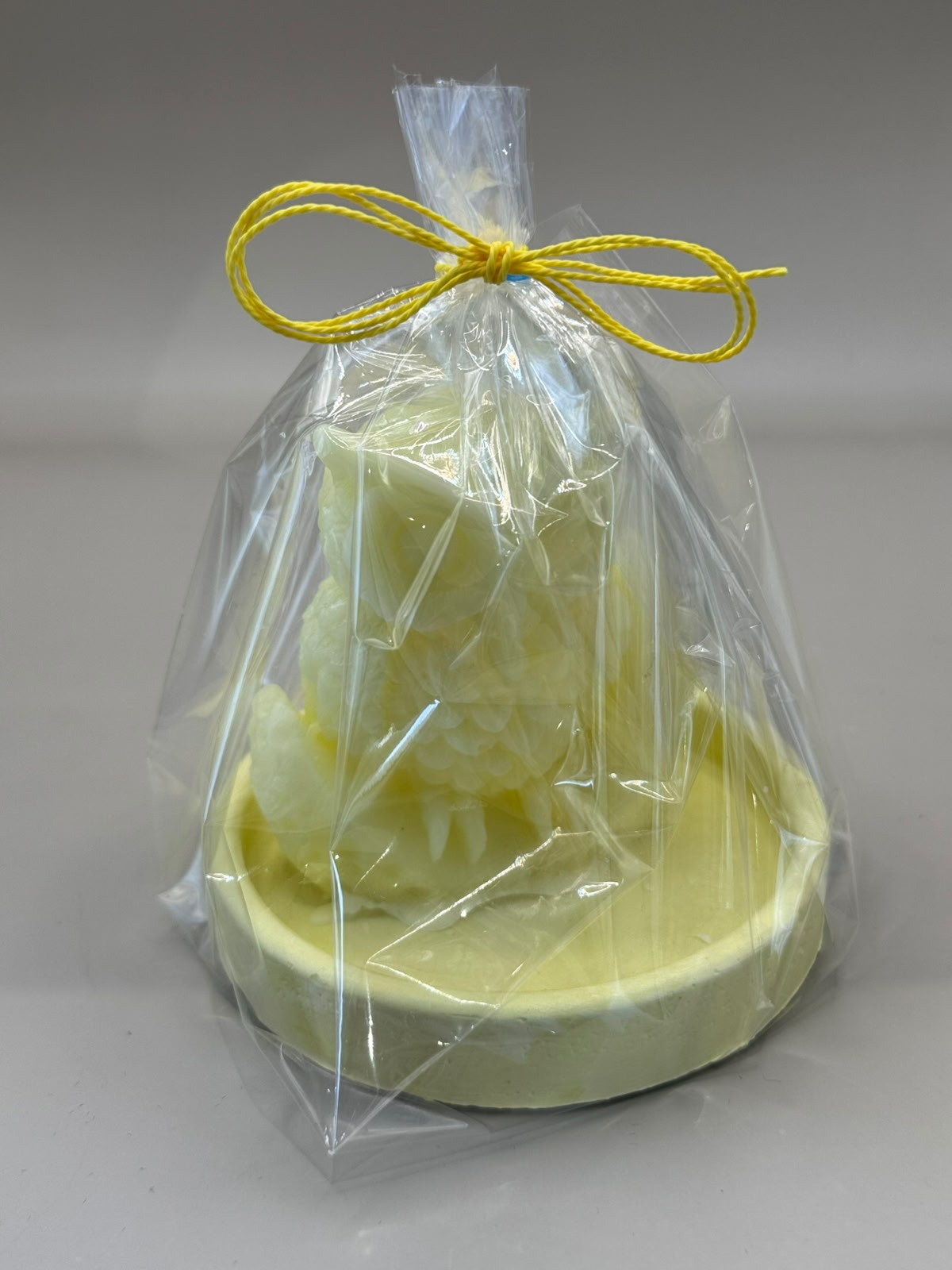 Single Owl scented candle on ceramic footpiece
