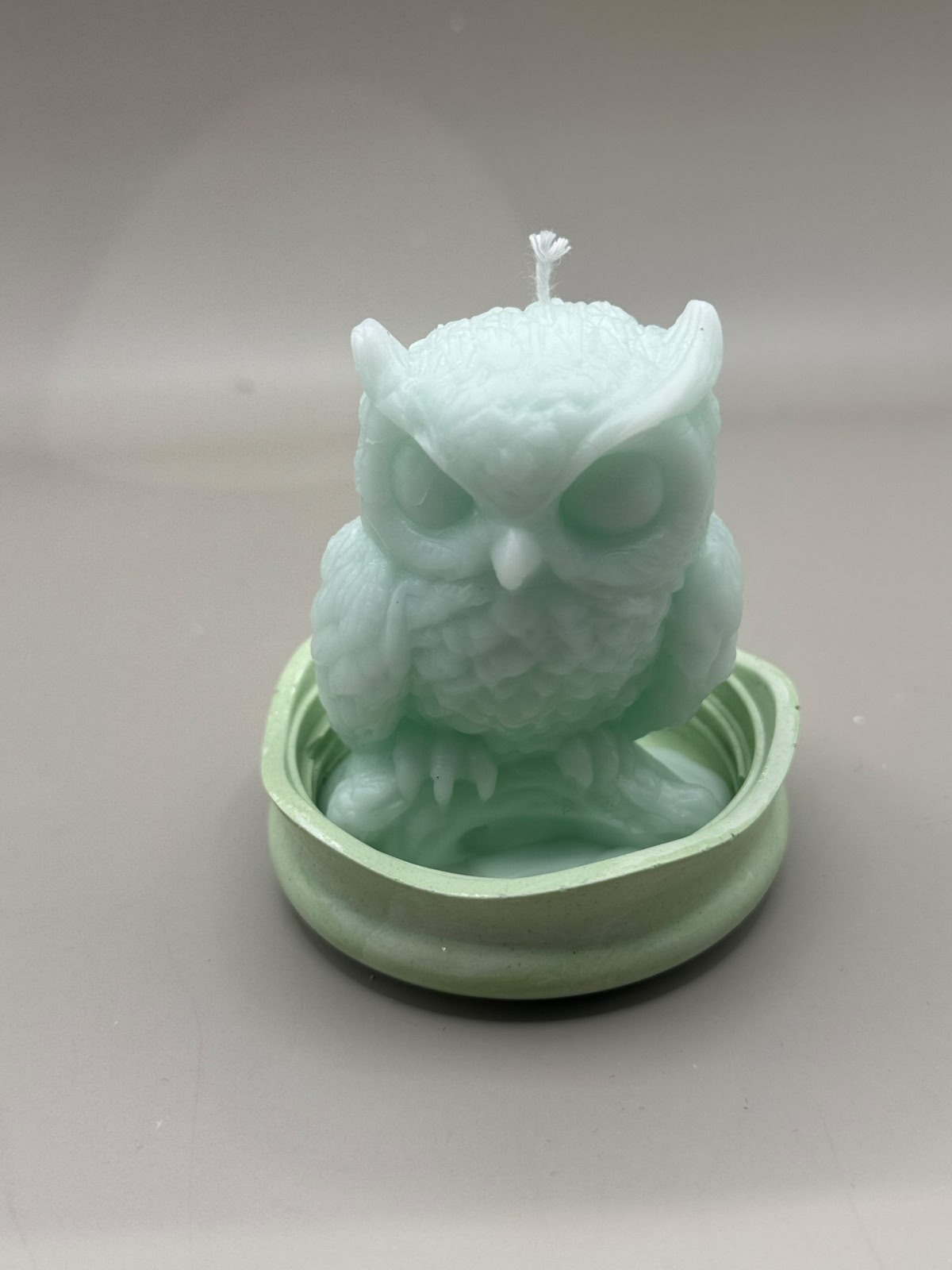 Single Owl scented candle on ceramic footpiece