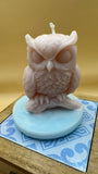 Single Owl scented candle on ceramic footpiece